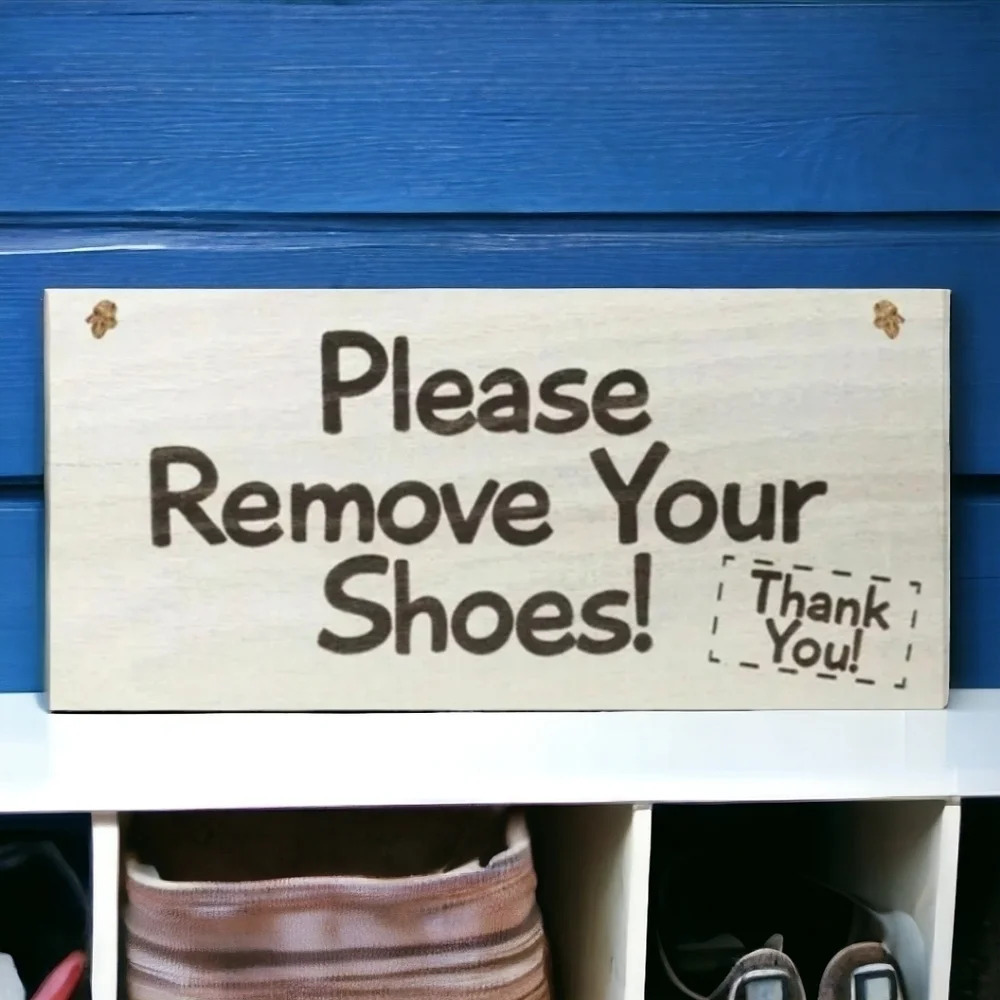 "please remove your shoes, thank you" hanging wooden sign